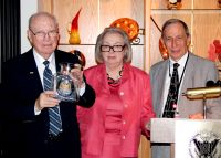 Dr. Daniel B. Crowder, at left, the founding president of West Virginia Northern Community College, addressed guests at a 40th anniversary luncheon at the college earlier this week. He was introduced by Dr. Mary Marockie, center, president of the WVNCC Foundation board of trustees. At right is Dr. Martin J. Olshinsky, Northern’s president, who presented an update on the college’s current expansion projects. Crowder is holding a Blenko Glass pitcher, engraved with the college seal, which will be given to donors enrolling in the Crowder Legacy Society.