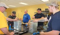 A technical trainer from Pittsburgh Valve & Fitting Co. recently provided hands-on classroom training to Petroleum Technology students at West Virginia Northern Community College. From left are Keith Carroll, Jimmy Blake, Technical Trainer Mike Gagel, Kody White and Gage Francis.