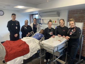 Students show off the new equipment in the Simulation Lab.