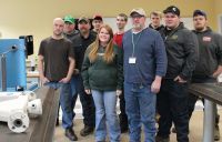 Students in the Petroleum Technology program at West Virginia Northern Community College meet with Denny Russell of Pegasus Optimization Managers, LLC, which provided lab equipment valuable to the learning process. From left are Randy Donahue, Erik Wojtowicz, Russell, Ricky Yoho, Sarah Morse, Corey Carroll, Keith Carroll, Robert Walker, Kody White and Gage Francis.
