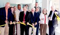 The ceremonial ribbon was cut Monday to open the new Applied Technology Center at West Virginia Northern Community College’s Wheeling campus. From left are West Virginia Del. Michael Ferro, Marshall County; West Virginia First District Sen. Rocky Fitzsimmons; Fred Renzella, member, WVNCC board of governors; Dr. Darrell Cummings, president of the board of governors, WVNCC President Martin J. Olshinsky; John Clarke, board of governors member; Vic Greco of SMG Architects, Wheeling; Dr. Mary Marockie, president of the WVNCC Foundation board; and James Skidmore, chancellor of the West Virginia Community and Technical College System. In the back, from left and partially obscured are Mike Koon, WVNCC vice president of workforce development, and Steve Lippiello, WVNCC vice president of administrative services/CFO. Back row at right is Joe DeSalvo, owner of DeSalvo Construction Co. of Hubbard, OH, main contractor on the project.  