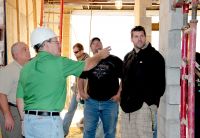 West Virginia Northern Community College Program Director Joseph M. Remias, at left, oversees a tour of the construction site of the college’s Applied Technology Center in downtown Wheeling. Remias and James Baller, WVNCC director of facilities, second from left, led a group of nine students on an informational field trip as part of their course work in Refrigeration, Air Conditioning and Heating Technology, Industrial Maintenance Technology and/or Appliance Repair. Students shown, from left, are Justin C. Caprita, Mark L. Latimer and Thomas R. Leach.