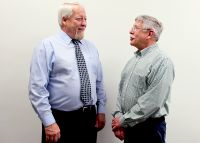 Kevin Serig, student disabilities counselor at West Virginia Northern Community College, at left, discusses the new partnership with Ed Nolan, director of operations at Northwood Health Systems.