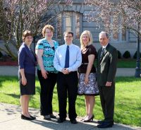 From left, Janet Fike, vice president of student services; Ida Williams, student activities program coordinator; student Nathan Schmidt, Shannon Payton, director of student activities, and Dr. Martin J. Olshinsky, president of the college.
