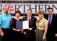 An Apprenticeship Core Group has been meeting on the Wheeling campus of West Virginia Northern Community College to plan for an associate degree and certificate that would be offered at Northern in conjunction with apprenticeship program certification. Displaying a city of Wheeling proclamation declaring Nov. 2-8 as “Apprenticeship Week” are, from left, Michael A. Ferrari, U.S. Department of Labor Office of Apprenticeship, Martinsburg; Dr. Vicki L. Riley, WVNCC president; Kenneth W. Milnes, labor department office of apprenticeship state director, Charleston; Dr. Carry DeAtley, Northern’s vice president of academic affairs; and Dr. Samuel W. White, associate professor, Institute for Labor Studies and Research, West Virginia University.