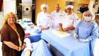 The Culinary Arts and Surgical Technology programs at West Virginia Northern Community College have partnered in a unique way: both are using parts of a pig for student learning. From left are Bonnie Peterman, instructor and director of Northern’s surgical technology program; culinary arts student Rebecca Bennett of New Martinsville; Chef Chris Kefauver, assistant professor of culinary arts; culinary arts student Anthony Wheeler of Wheeling; and Debbie Fitzgerald, surgical technology instructor.